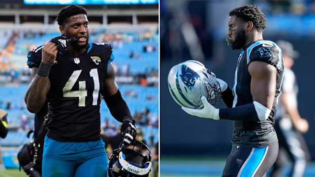 Josh Allen pulls his glove off by biting down on it; Brian Burns holds his helmet